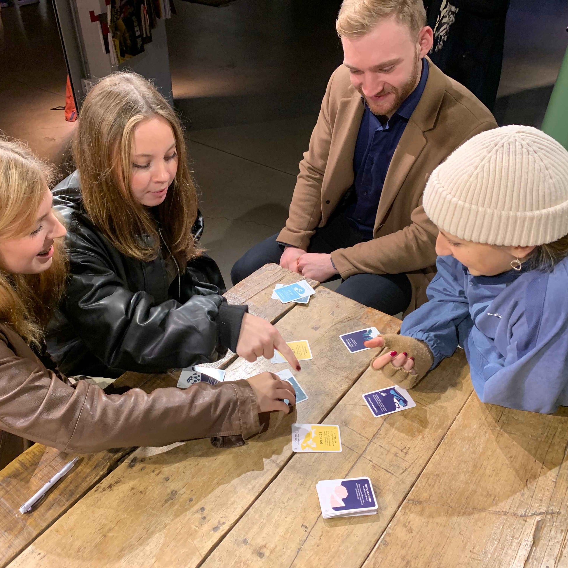 Group of students play cards